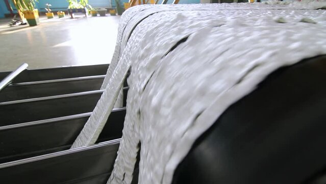 Stages of Carbon Fiber Manufacturing at the Factory. Artificial Synthetic Acrylic White Fibre Production Line at the Chemical Plant.