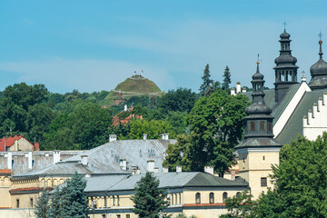 Krakow, Poland: Convent of Norbertine Sisters at Vistula River in Salwator and far view of Wolski Forest and Kosiuszko Mound - obrazy, fototapety, plakaty