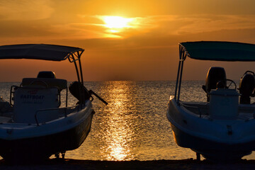golden sunset or sunrise at sea. yellow and orange sky. romantic beautiful sky. heavenly sky. new...