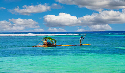 Beautiful exotic caribbean reef lagoon, romantic bamboo raft tour, turquoise sea horizon, blue sky...