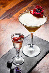 tasty cocktail with flower in bar