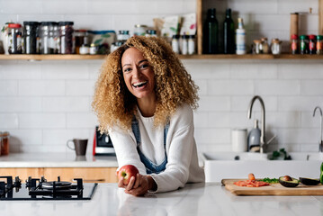Portrait of a woman in the kitchen.