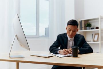 man sitting at a desk in front of a computer emotions technologies