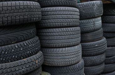 Stacks of used and worn car tyres..