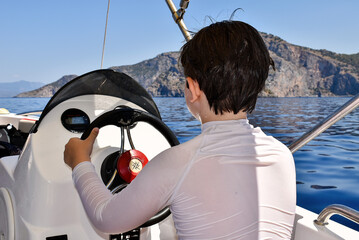 person sailing on the yacht