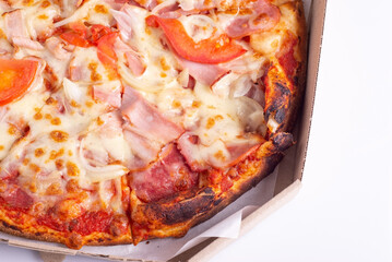 burnt meat pizza in a box on a white background