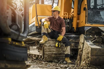 Fotobehang Professional Construction Crawler Equipment Operator © Tomasz Zajda