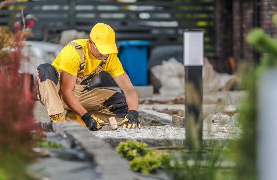 Landscaping Worker Building Backyard Garden Bricks Path