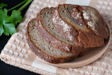 Sliced rye bread on a wooden table