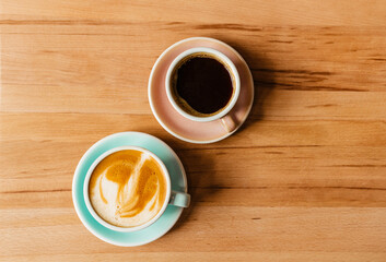Delicious cappuccino on nut milk in a blue mug. Coffee on vegetable vegan milk with a beautiful foam. Hot Strong American Flatlay