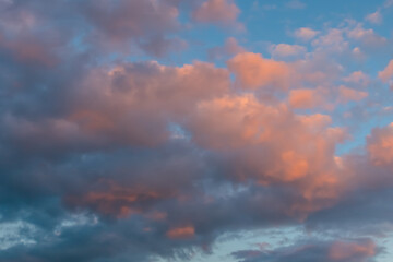 Dramatic sunset clouds against blue sky at dusk to night. Nature, freedom, peaceful concept