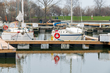 Yachts in the water at at a yacht club in spring.  Shot in Toronto's Ashbridges Bay in May.