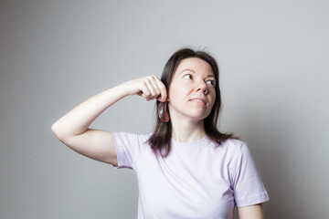 Fototapeta premium woman woman smiling and joking trying on an eye patch instead of earrings