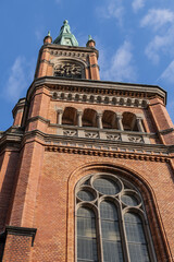 Fototapeta na wymiar Protestant St John's Church (Johanneskirche, 88 m high tower) in the square of Martin-Luther place. Church built from 1875 to 1881 in Romanesque Revival style. DUSSELDORF, GERMANY.