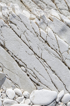 Texture of gray natural material with cracks. Limestone. Cyprus.