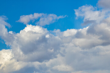 Naklejka na ściany i meble Blue sky with clouds at a sunny day.