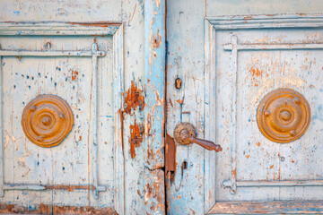 Detailed view of a richly shaped wooden door.