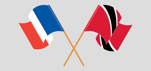 Crossed and waving flags of France and Trinidad and Tobago
