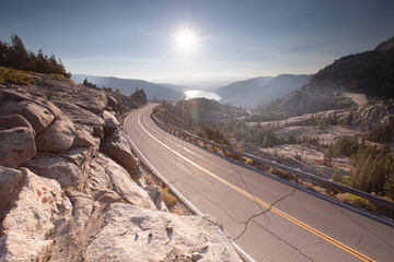 Mountain road with lake in background