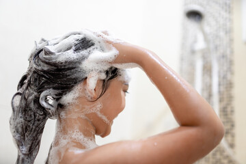 Little Asian girl take a bath