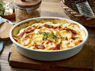 bowl of freshly baked potato gratin