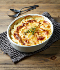 bowl of freshly baked potato gratin