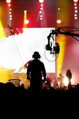 The cameraman is recording and broadcasting live concerts on camcorders. Professional Video...