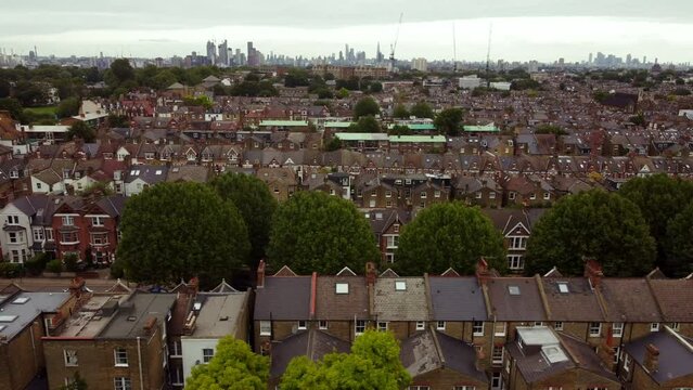 Aerial view of low-rise buildings in Balham and London City in the background.