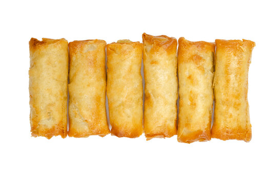 Group of mini spring rolls, ready to eat, in a row, from above. Small spring rolls, crispy baked in the oven. Filled and rolled wrappers, appetizers in Asian cuisine. Close-up, isolated over white.