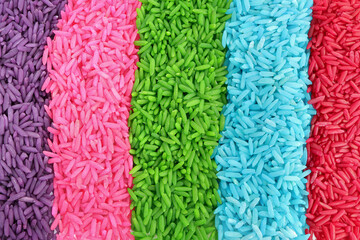 Close up of colored rice on a white background. rainbow color rice