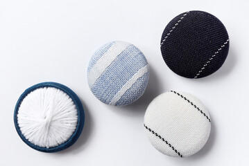 Fabric buttons background, Craft, needlework concept. Cloth buttons on white background, Top view.