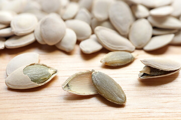 Pumpkin seeds, raw green organic pumpkin seed on a white background. 