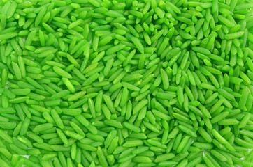 Close up of green rice on a white background. green color rice, from above.