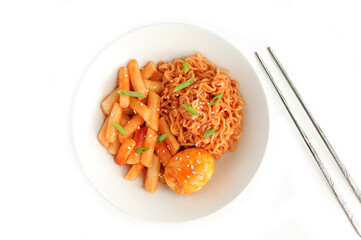 Closeup of Tteokbokki or korean spicy rice cake and korean instant noodle in korean spicy sauce with boiled egg. Korean food style