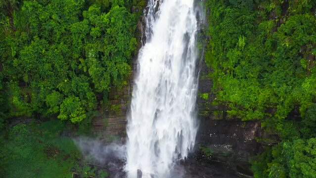 Aerial drone of Waterfall in the tropical forest. Mapalana Falls. Sri Lanka.