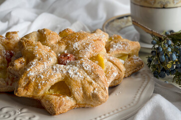 delicious breakfast on sunny morning. Baked puff pastry and cup of coffee