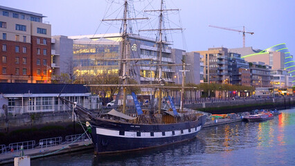 Fototapeta na wymiar Old sailing boat on River Liffey in Dublin - Ireland travel photography