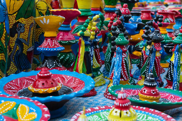 Fototapeta premium Beautiful painted colorful terracotta pots, works of handicraft, for sale during Handicraft Fair in Kolkata.