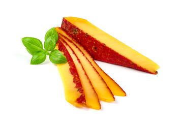 Traditional semi-hard cheese with herbs and tomatoes, isolated on white background.