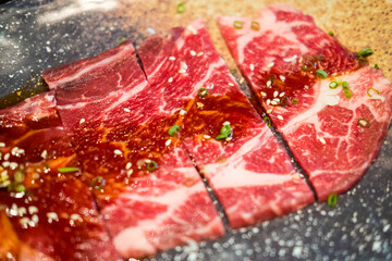 Premium Japanese sliced wagyu beef on plate for yakiniku.