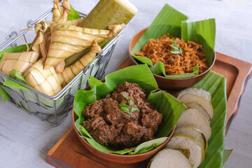 Traditional Muslim food popular among Malaysian. Lemang, Ketupat Palas, Ketupat, Beef Rendang, Beef Serundeng Background. A dish eaten after breaking fast and during Hari Raya.