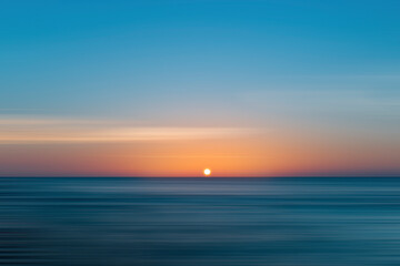 Beautiful sunset over the sea, with sweeping technique.