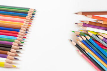 Colored pencils isolated on white background.
Education, kindergarten concept. Idea of ​​pedagogy concept.view from the top.