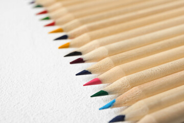 Colorful pencils on light background