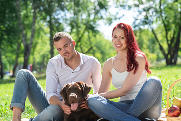 Couple with a dog in the park