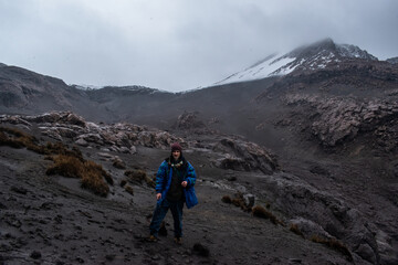 hiker in the mountains snowy