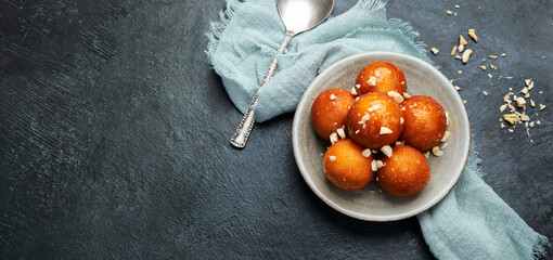 Gulab Jamun on gray background.