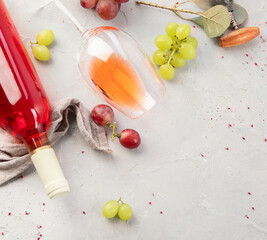 Bottle of rose wine on gray background.