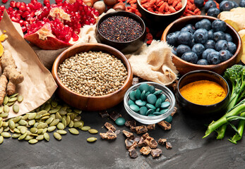 Healthy food clean eating selection on dark background.
