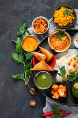 Indian Thali on dark background.